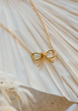 Utepe Brass Bow Necklace